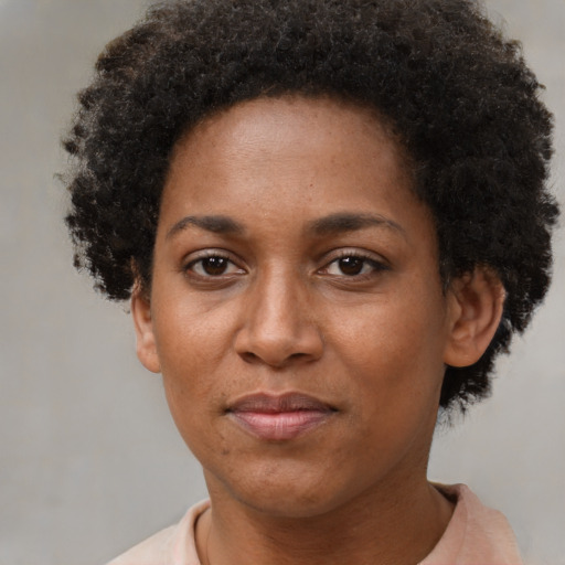 Neutral black young-adult female with short  brown hair and brown eyes