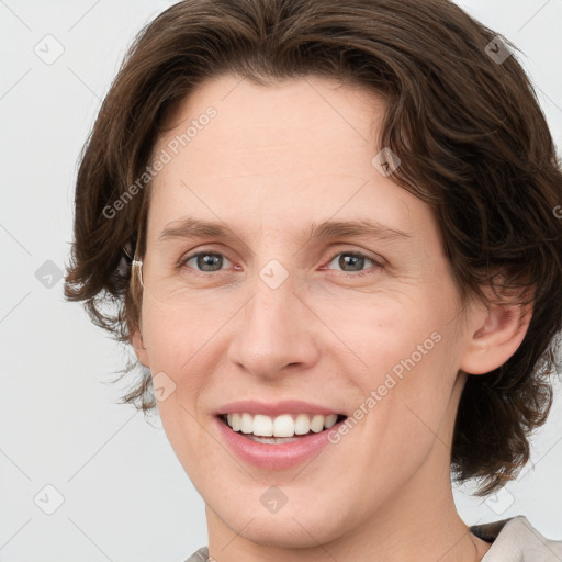 Joyful white young-adult female with medium  brown hair and green eyes