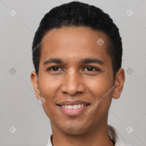 Joyful latino young-adult male with short  black hair and brown eyes