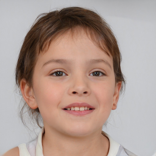 Joyful white child female with medium  brown hair and brown eyes