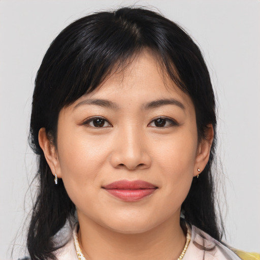Joyful asian young-adult female with medium  brown hair and brown eyes