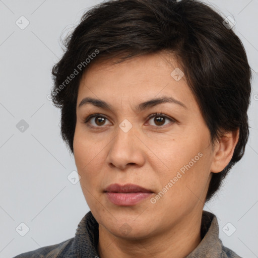 Joyful white adult female with short  brown hair and brown eyes