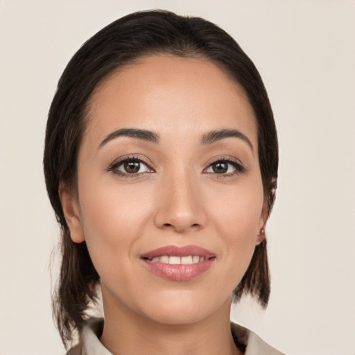 Joyful white young-adult female with medium  brown hair and brown eyes