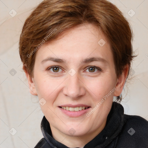 Joyful white adult female with medium  brown hair and grey eyes