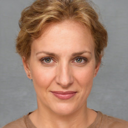 Joyful white adult female with short  brown hair and brown eyes