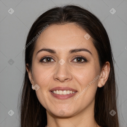 Joyful white young-adult female with long  brown hair and brown eyes