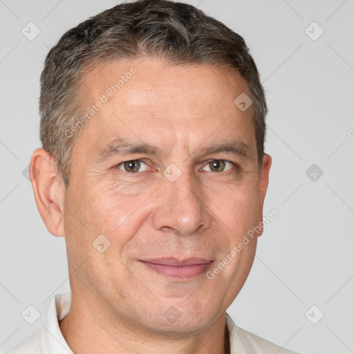 Joyful white adult male with short  brown hair and brown eyes