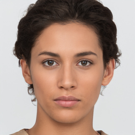 Neutral white young-adult female with short  brown hair and brown eyes