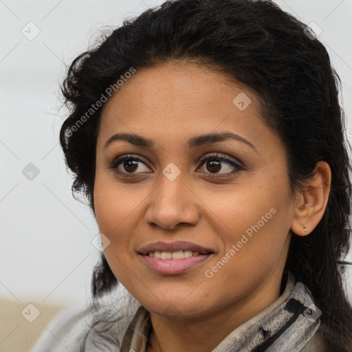 Joyful latino young-adult female with long  brown hair and brown eyes