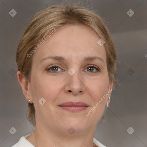 Joyful white adult female with medium  brown hair and grey eyes