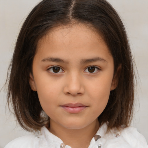 Joyful white child female with medium  brown hair and brown eyes