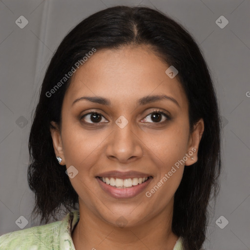 Joyful latino young-adult female with long  brown hair and brown eyes