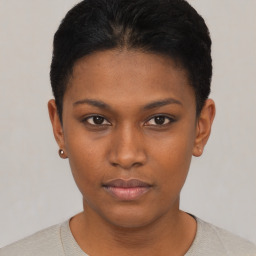 Neutral black young-adult female with short  black hair and brown eyes