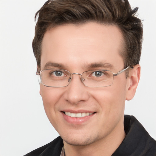 Joyful white adult male with short  brown hair and grey eyes