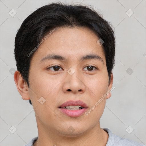 Joyful asian young-adult male with short  brown hair and brown eyes