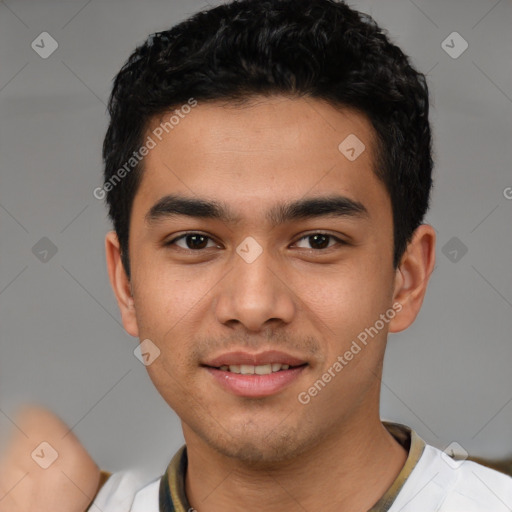 Joyful latino young-adult male with short  black hair and brown eyes