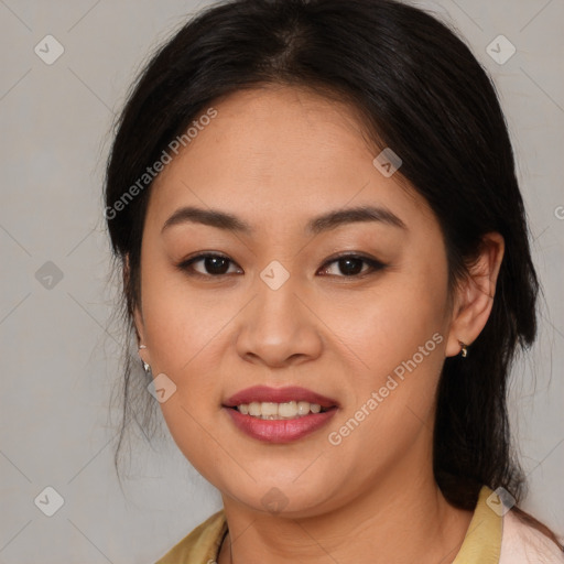 Joyful latino young-adult female with medium  brown hair and brown eyes