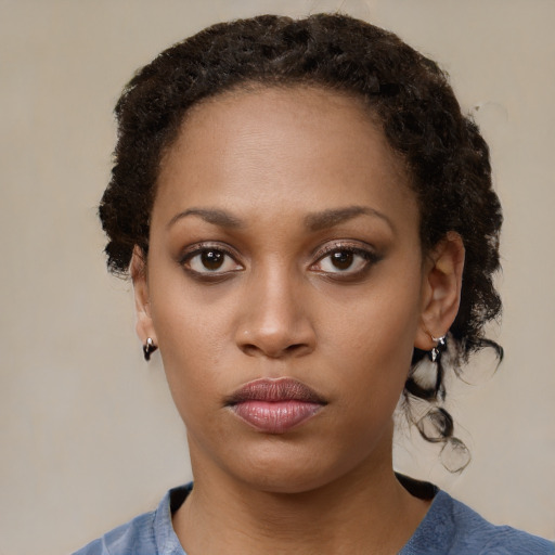 Neutral black young-adult female with medium  brown hair and brown eyes
