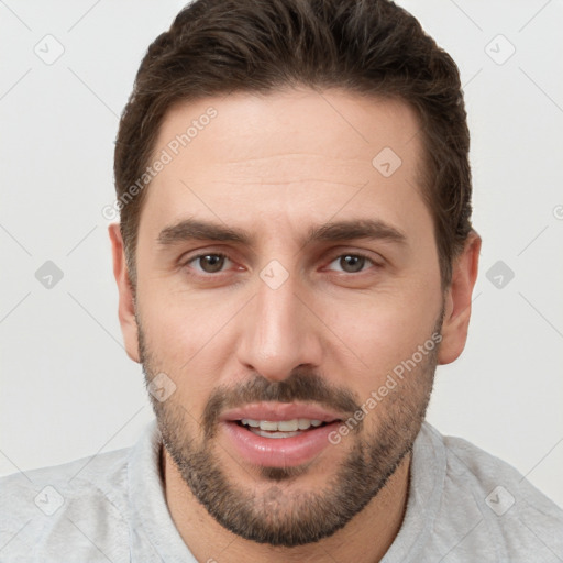 Joyful white young-adult male with short  brown hair and brown eyes