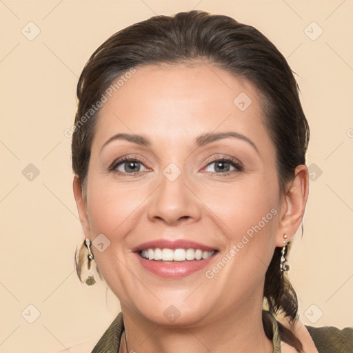 Joyful white adult female with medium  brown hair and brown eyes