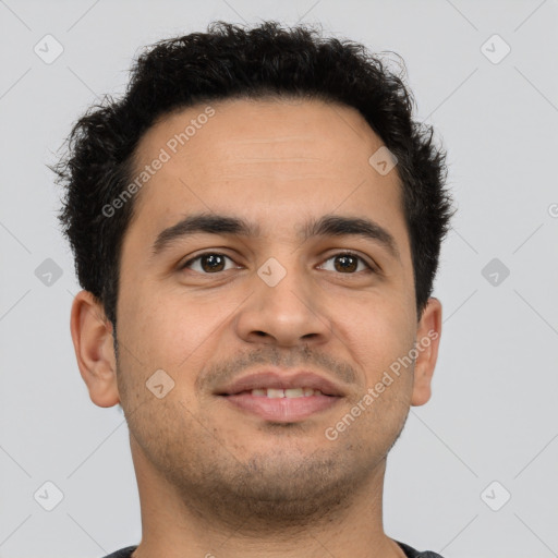 Joyful latino young-adult male with short  brown hair and brown eyes