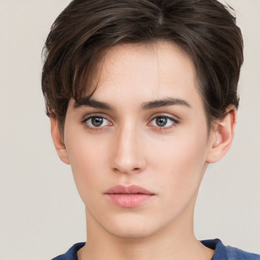 Neutral white young-adult female with short  brown hair and brown eyes