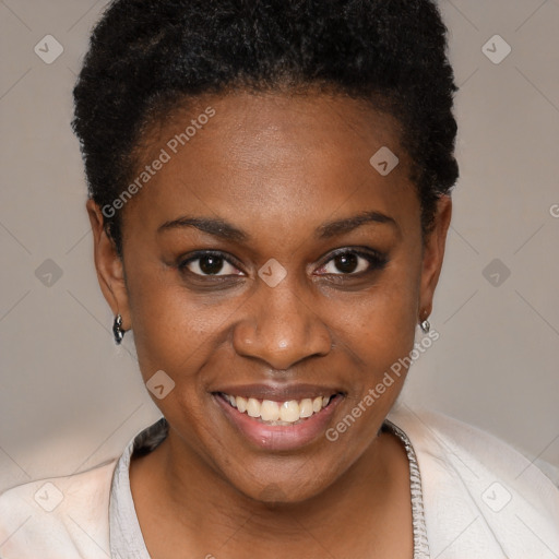 Joyful black young-adult female with short  brown hair and brown eyes