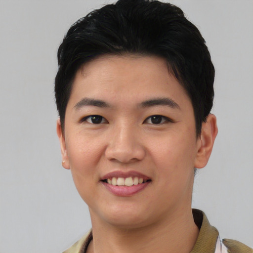 Joyful asian young-adult female with short  black hair and brown eyes
