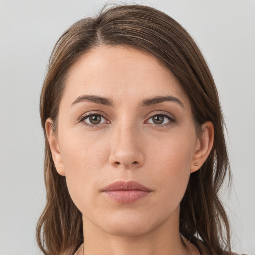 Neutral white young-adult female with long  brown hair and grey eyes