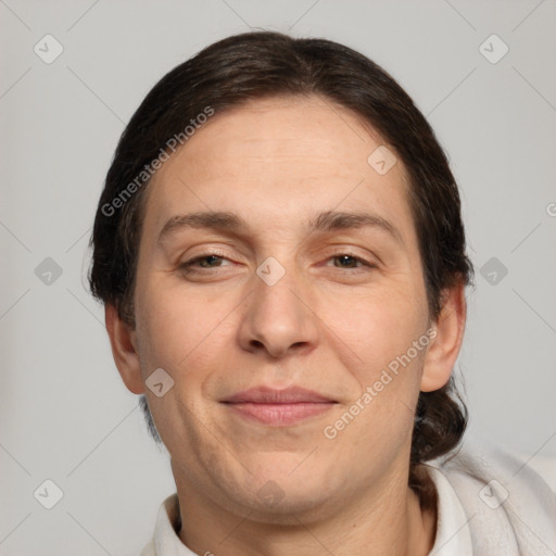 Joyful white adult female with short  brown hair and brown eyes