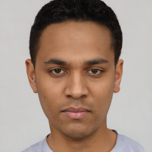 Neutral latino young-adult male with short  black hair and brown eyes