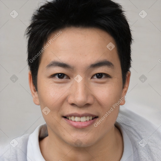 Joyful asian young-adult male with short  brown hair and brown eyes