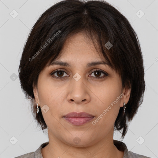 Joyful white adult female with medium  brown hair and brown eyes