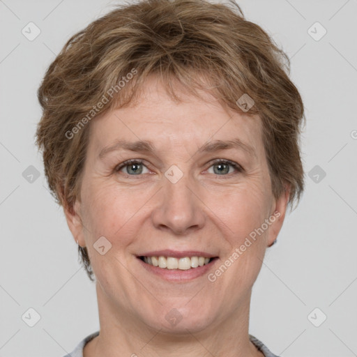 Joyful white adult female with short  brown hair and grey eyes