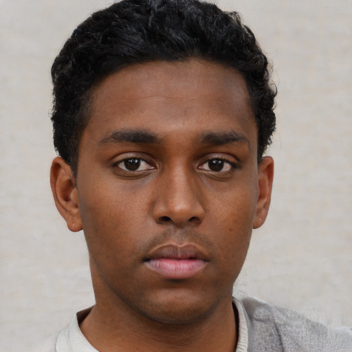 Neutral black young-adult male with short  brown hair and brown eyes