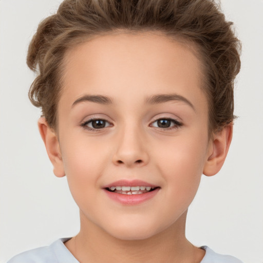 Joyful white child female with short  brown hair and brown eyes