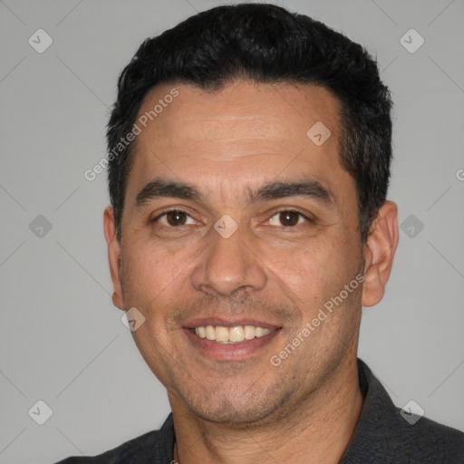 Joyful white adult male with short  black hair and brown eyes