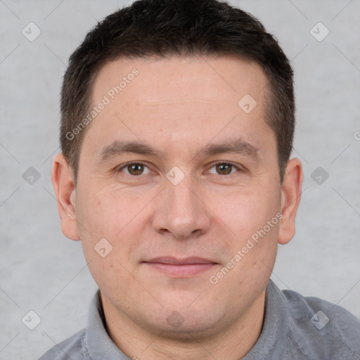 Joyful white adult male with short  brown hair and brown eyes