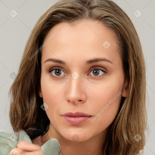 Neutral white young-adult female with medium  brown hair and brown eyes