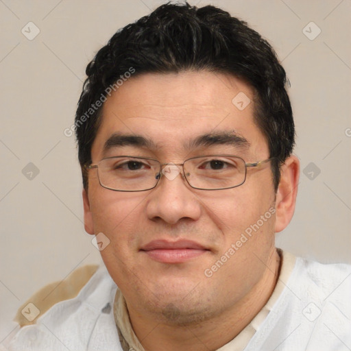 Joyful white adult male with short  black hair and brown eyes