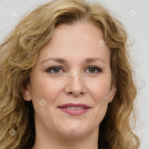 Joyful white young-adult female with long  brown hair and green eyes