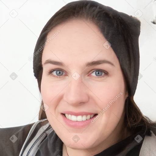 Joyful white young-adult female with medium  brown hair and grey eyes