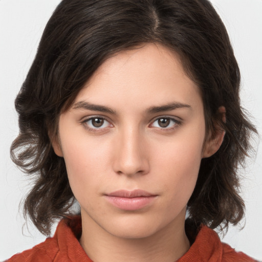 Neutral white young-adult female with medium  brown hair and brown eyes