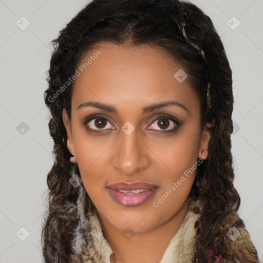 Joyful black young-adult female with long  brown hair and brown eyes