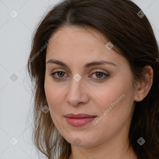 Joyful white young-adult female with long  brown hair and brown eyes