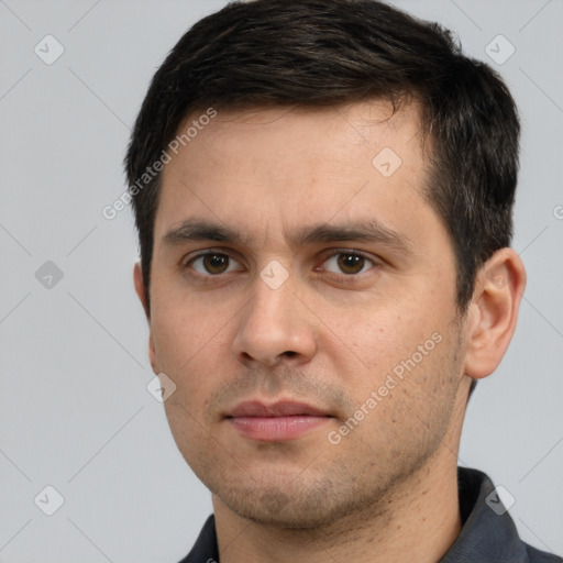 Neutral white young-adult male with short  brown hair and brown eyes