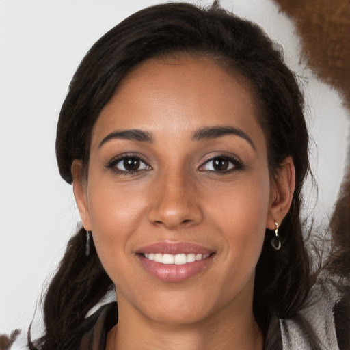 Joyful white young-adult female with long  brown hair and brown eyes