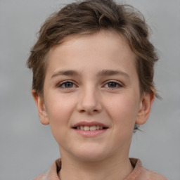 Joyful white child female with short  brown hair and brown eyes