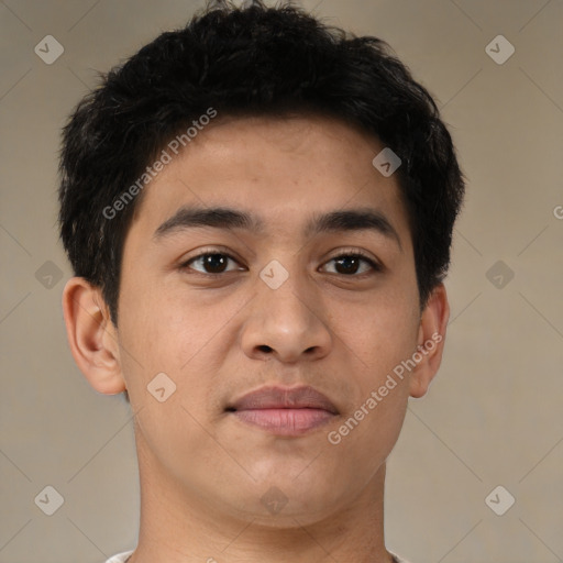 Joyful latino young-adult male with short  brown hair and brown eyes