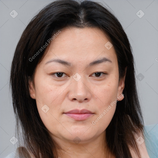 Joyful asian young-adult female with medium  brown hair and brown eyes